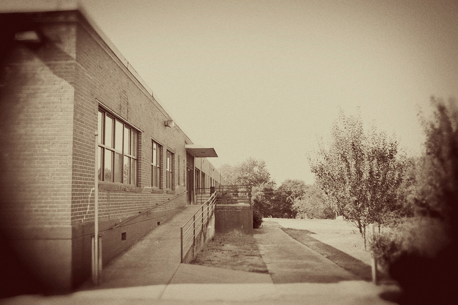 North-facing exterior of The Oriole Mill with newly planted apple orchard on adjacent grounds. 